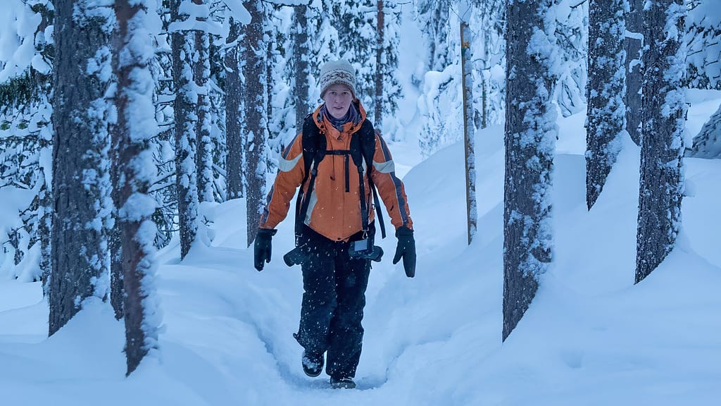 Photographer in snowy landscape